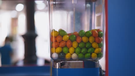 gumball vending machine installed in hall of shopping mall