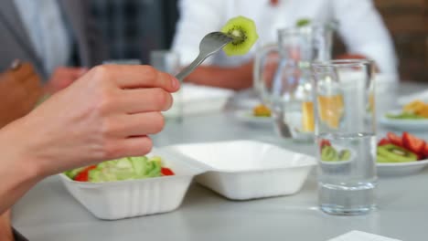 group of business executives having breakfast