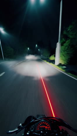 motorcycle night ride on wet road with red laser line