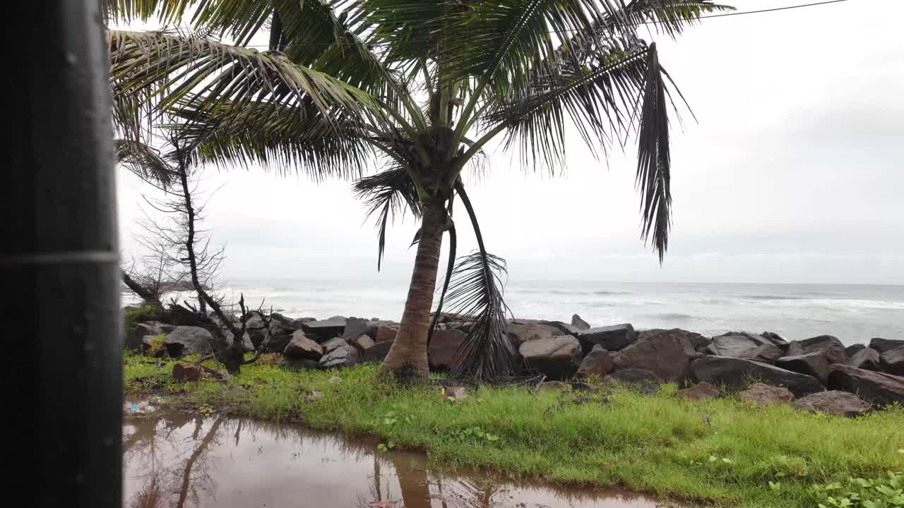 Sri Lanka rainy season wet weather flood puddle near Indian ocean tropical landscape