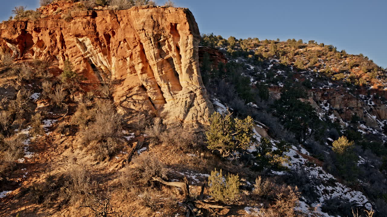 Sunrise drone capture of a magnificent natural arch in the red rock formations of Kanab, Utah.