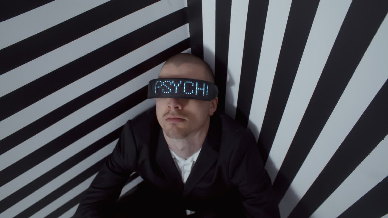 Man Wearing VR Headset in a Striped Room