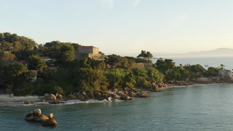 fortress at sunset aerial drone view circling, fortaleza sao jose da ponta grossa, jurere internacional, florianopolis, santa catarina, brazil