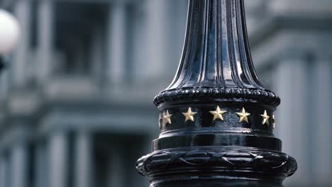 fancy government black street lamp with golden stars, in washington d.c. usa. symbols of power in the us capitol.