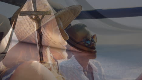 wearing hats and sunglasses, two people admiring animation by water