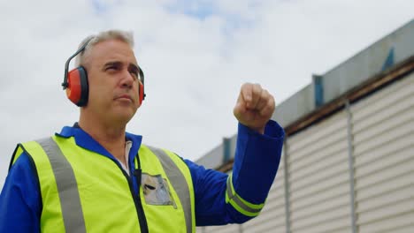 Male-engineer-gesturing-in-airport-4k