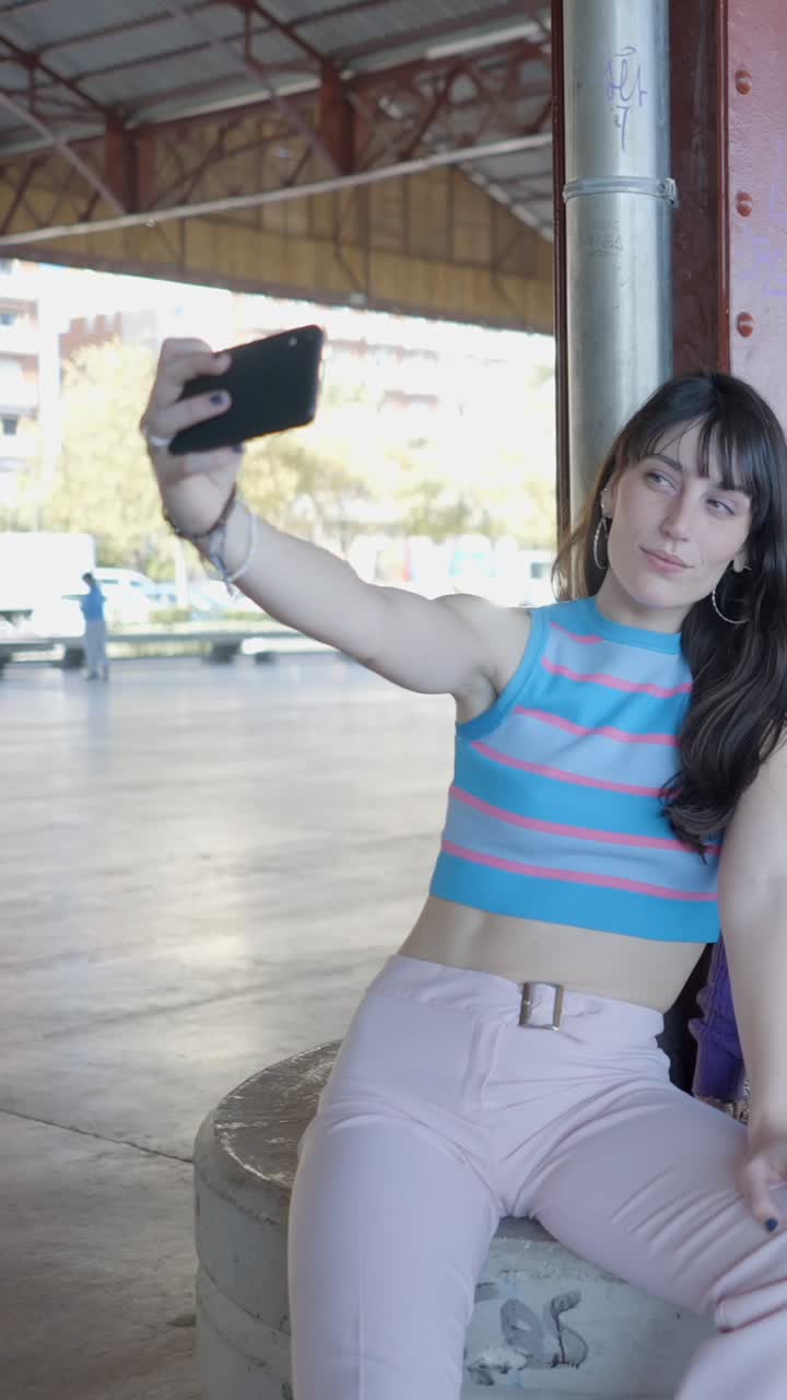 Young Women Taking a Selfie Together Outdoors