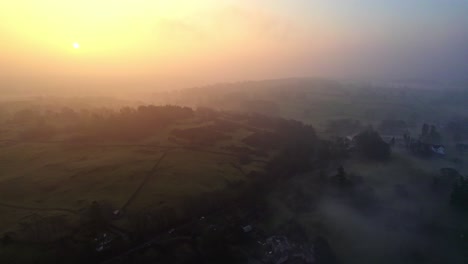 Thick-morning-mist-over-the-Cumbrian,-Lake-District-town-of-Bowness-on-Windermere