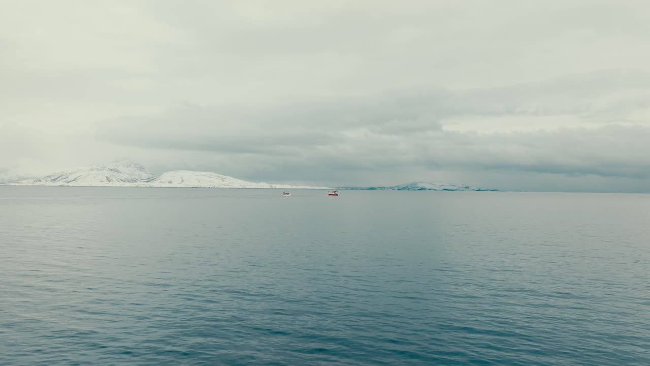 Fishing Boat In The Sea During Winter In Norway. - aerial shot