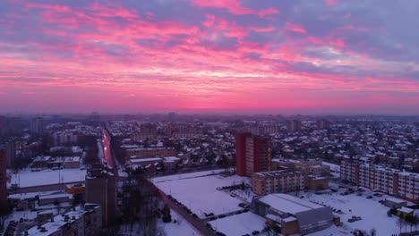 aerial view of apartments houses in winter, snowy environment, sunny day, flying above apartments round, parallax, lithuania