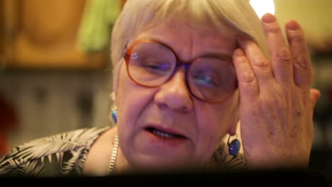 Modern elderly woman using skype