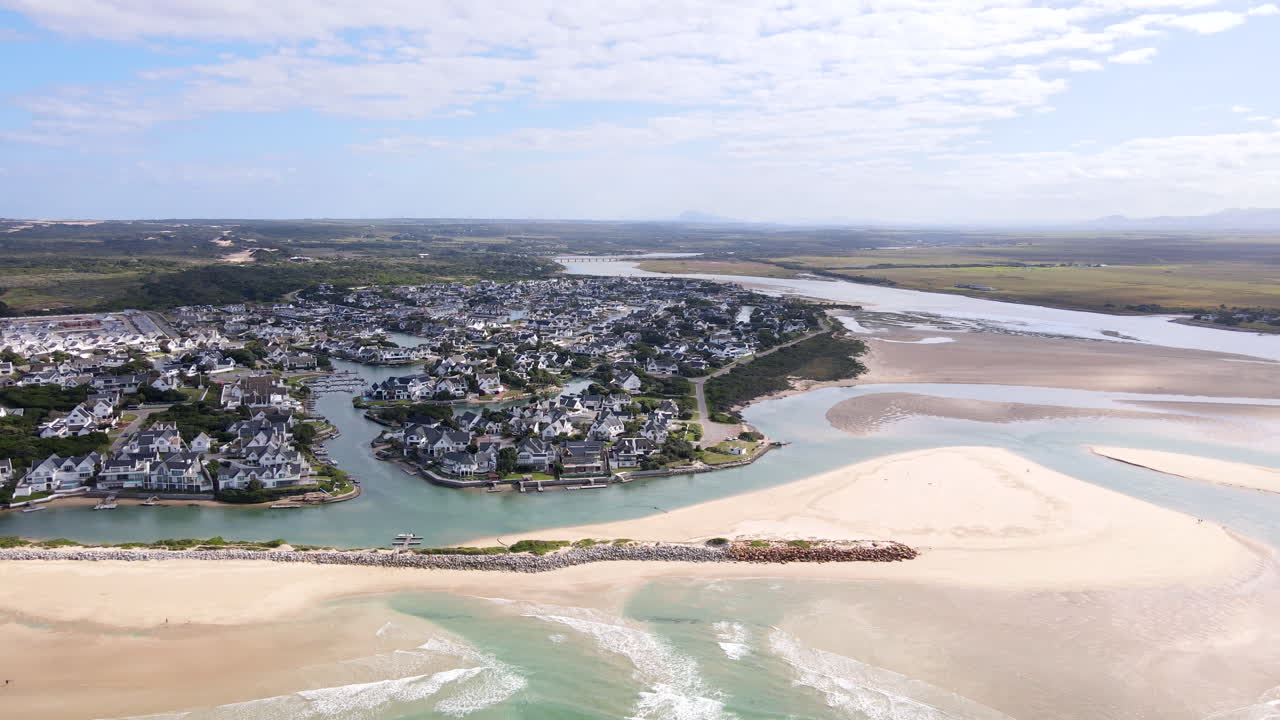 Wide aerial pullback view of exclusive St Francis Bay with Marina Glades canals