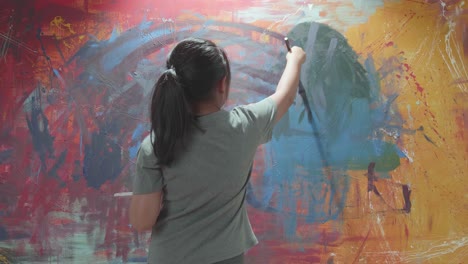 child painting on a wall