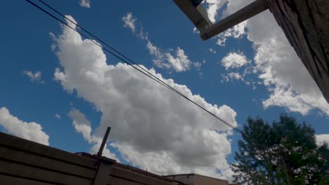 timelapse from a urban setting with clouds and a blue sky