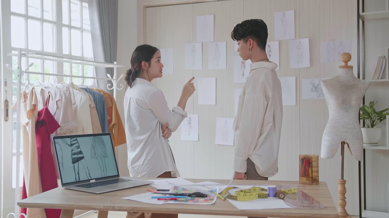 Fashion Designers Working on Sketches