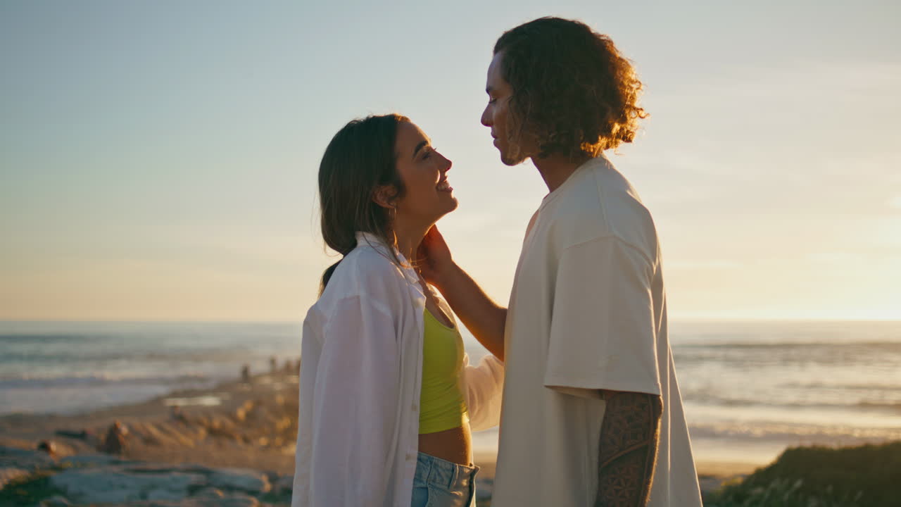 Couple enjoying a romantic sunset at the beach