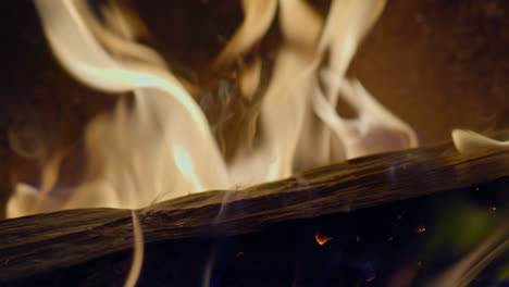 Slow-motion-shot-of-flames-and-embers-in-a-fireplace