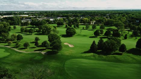 flying over stunning golf club full of green trees, northbrook , illinois, chicago