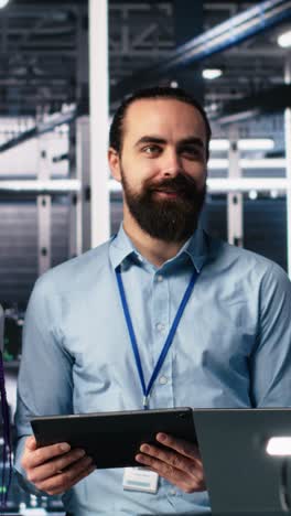 vertical video portrait of smiling engineers in server room using ai