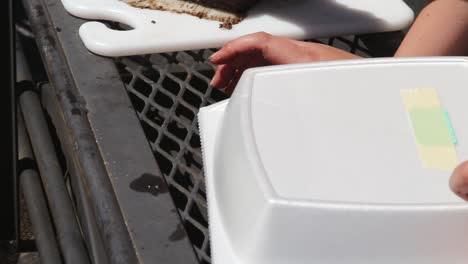 Slicing-brisket-to-get-it-ready-to-put-into-turn-in-container