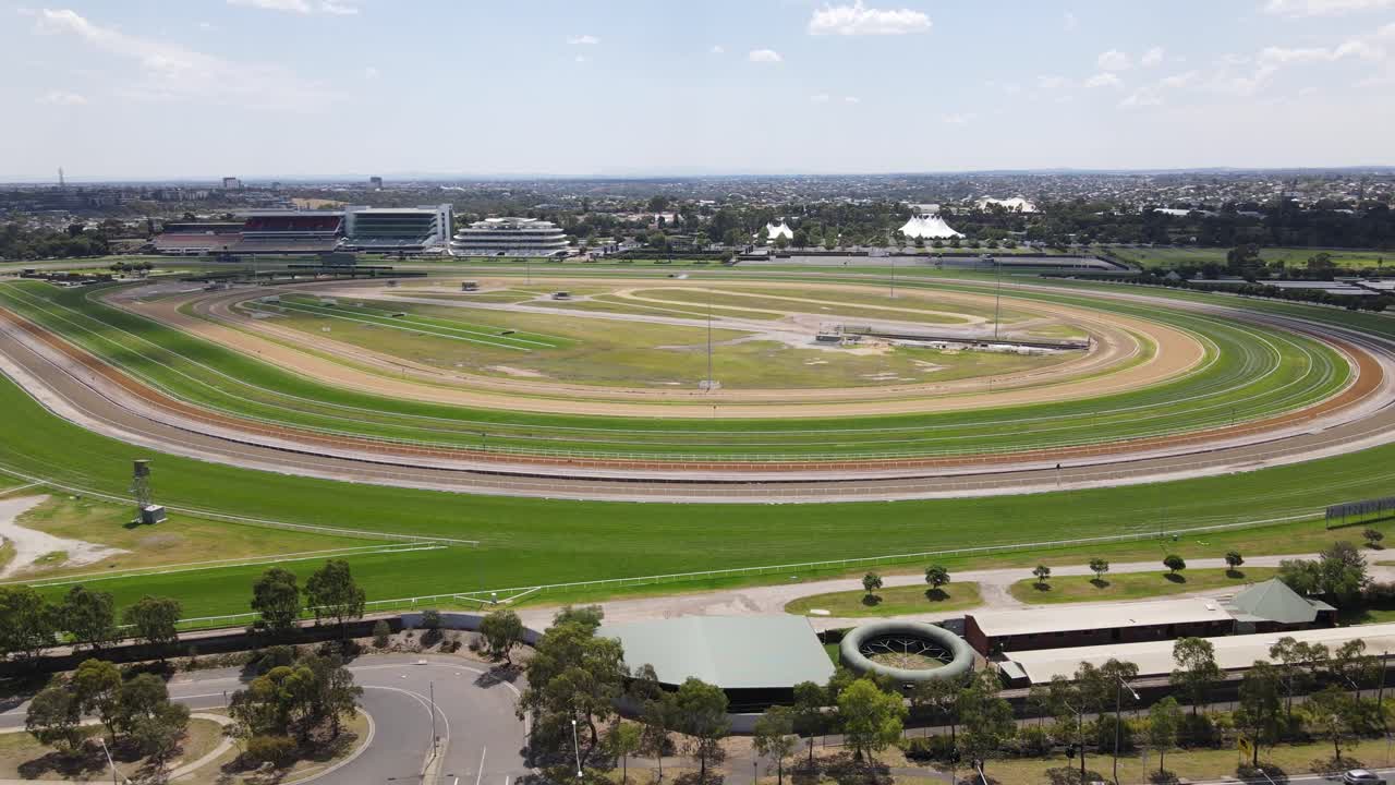 Aerial drone moves back from Flemington Racecourse, Melbourne, on a summer’s day