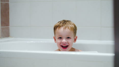 laughing boy in the bath