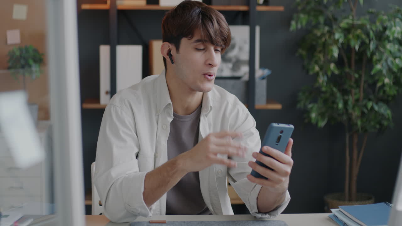 Man having a video call in an office setting