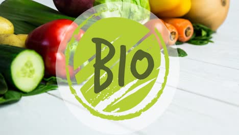 Animation-of-bio-text-in-green,-on-green-circle,-over-fresh-vegetables-on-white-boards