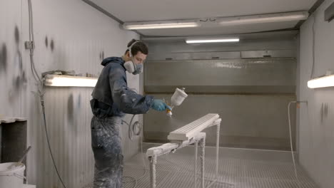 industrial painting process in a paint booth