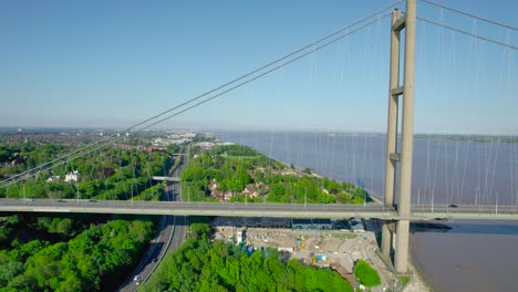 smooth tilt up descending aerial of the south towers of the humber bridge