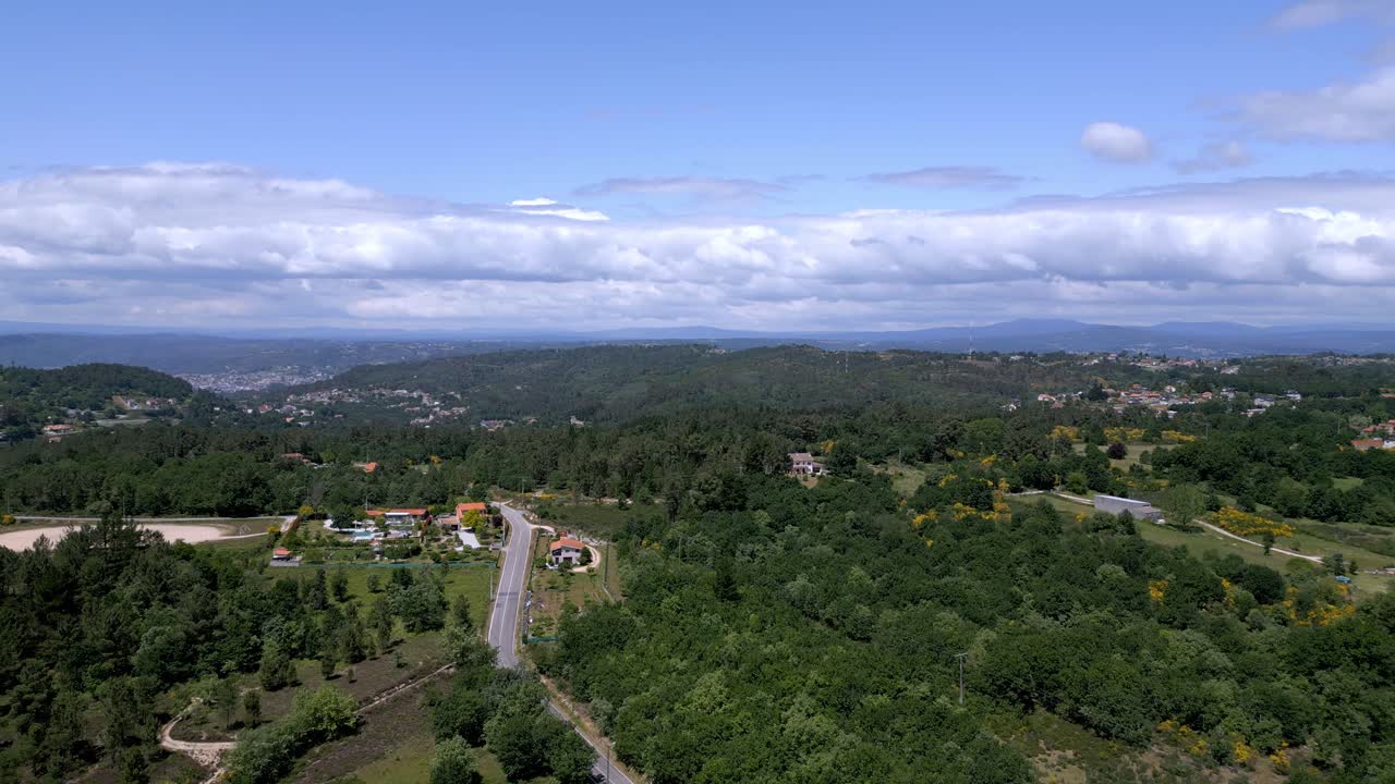 reveals Santa Marta Ourense Spain and lush green valley, Aerial rising pullback