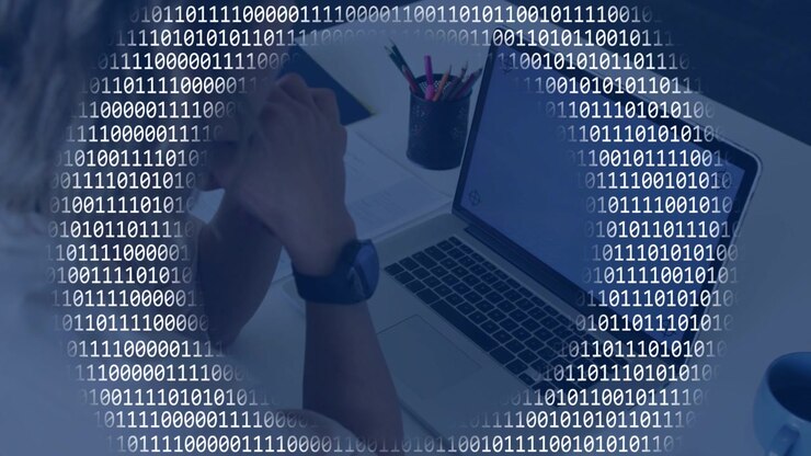 Woman clasping hands, laptop idle initiating binary overlay pulsing over desk, showing tech data