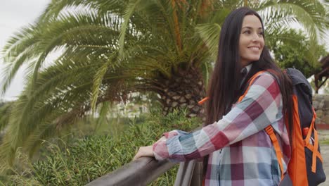 Happy-friendly-woman-wearing-a-backpack