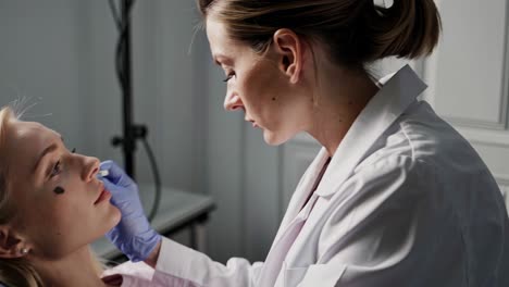 doctor examining patient's face