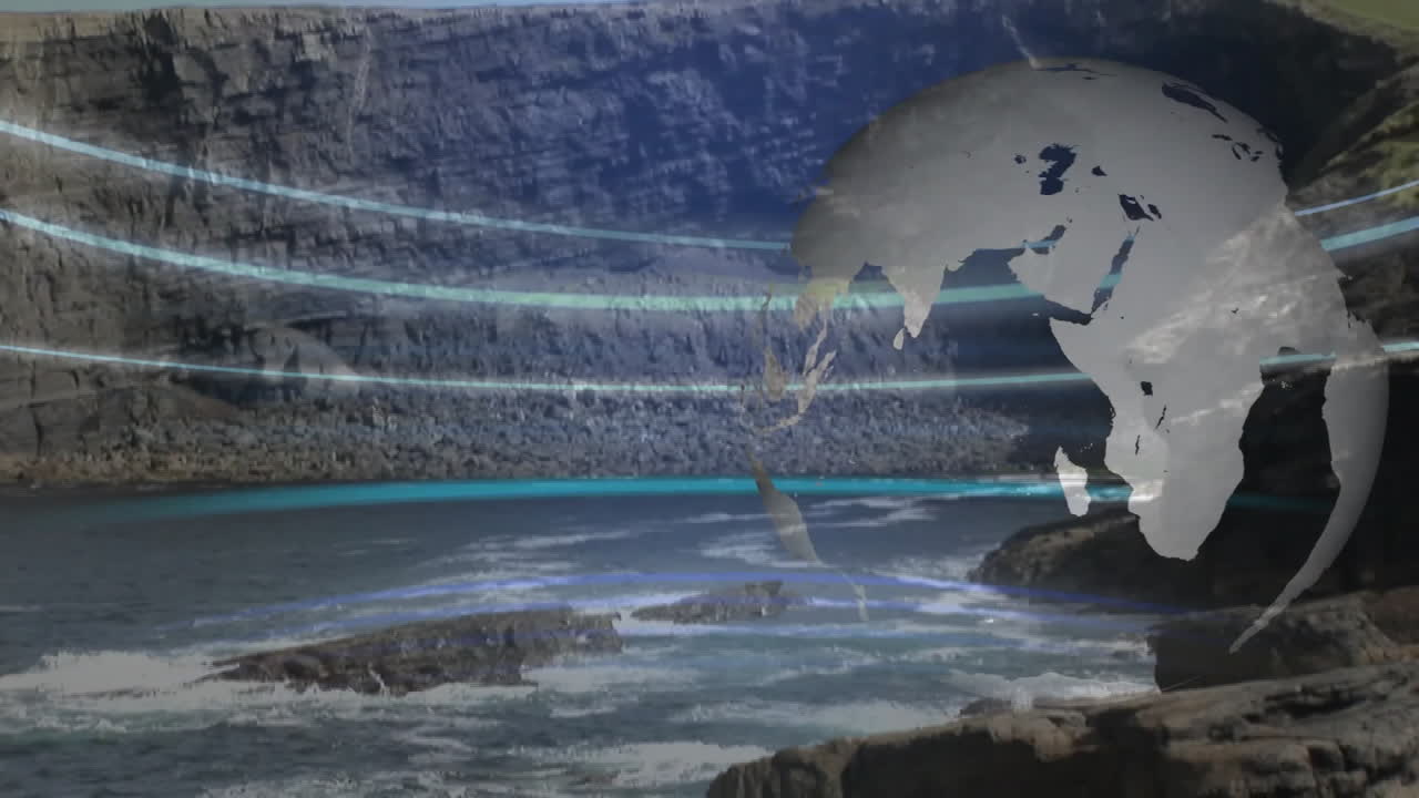 Animating globe over rocky coast with ocean waves in scenic view