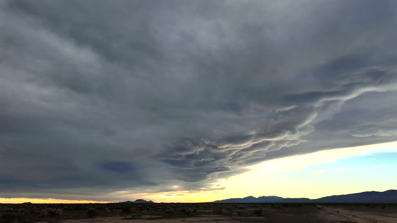 Stunning 4K time lapse of dramatic clouds moving over the Mojave Desert in Southern California cinematic quality atmospheric lighting stunning visuals