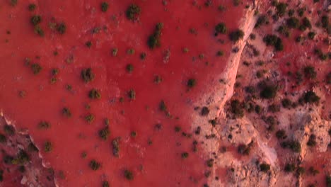 drone flying above the red rocky cliffs at snow canyon state park, st