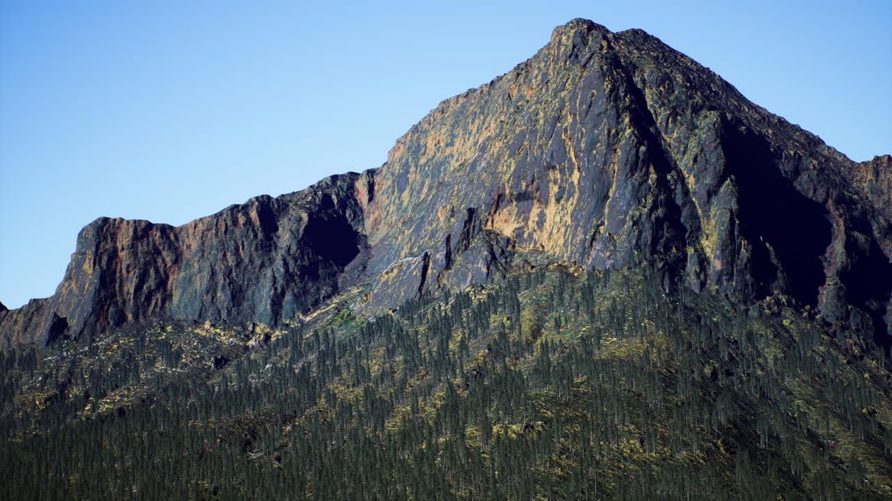 Majestic mountain peak towering over lush green forest landscape