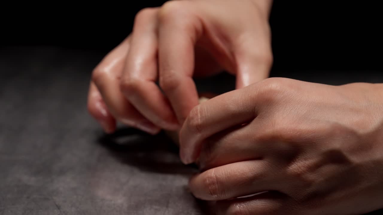 Close-up of Hands Folding and Shaping a Dumpling