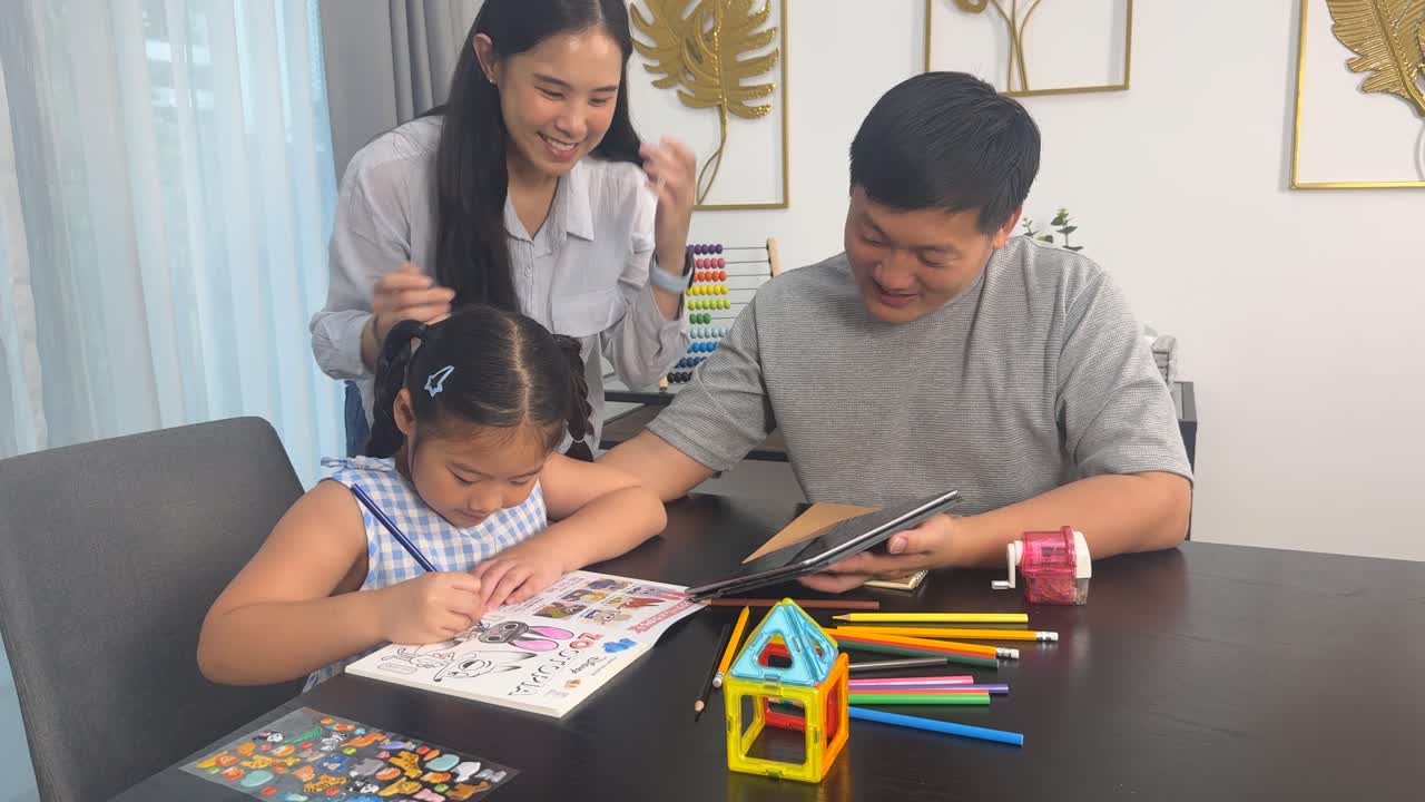 A family collaborates on a child's homework at a table, fostering learning and togetherness in a bright, cozy setting