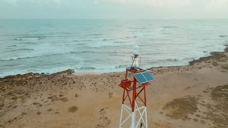 aerial view of a lighthouse in the desert and the sea, the northest point in colombia and southamerica, puntagallinas