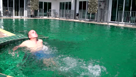 man relaxing in the outdoor hot tub