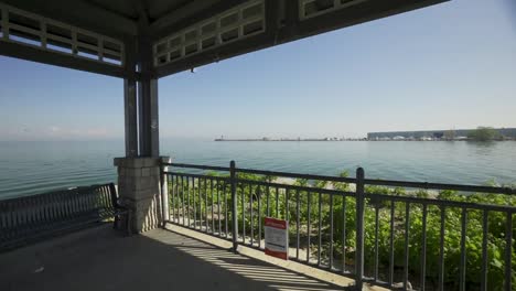 looking out at lake ontario from inside a gazebo on a sunny day in mississauga