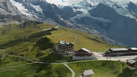 aerial approach of the hotel bellevue des alpes in kleine scheidegg, switzerland