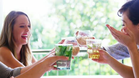 group of friends toasting drink glasses