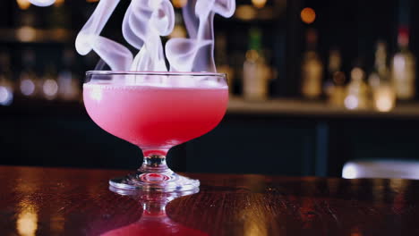 pink cocktail with smoke