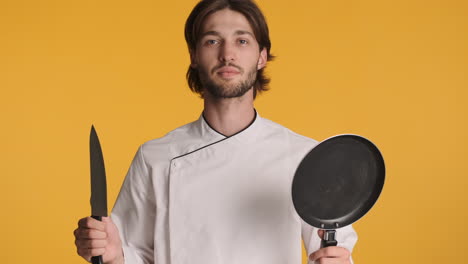 caucasian man in front of camera on yellow background.