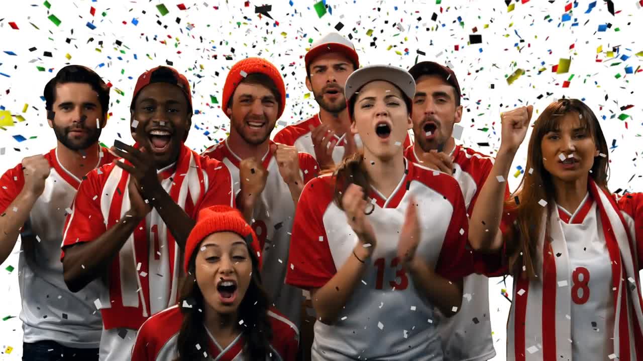 팬 들 이 콩페티 를 들고 팀 을 응원 하고 있다