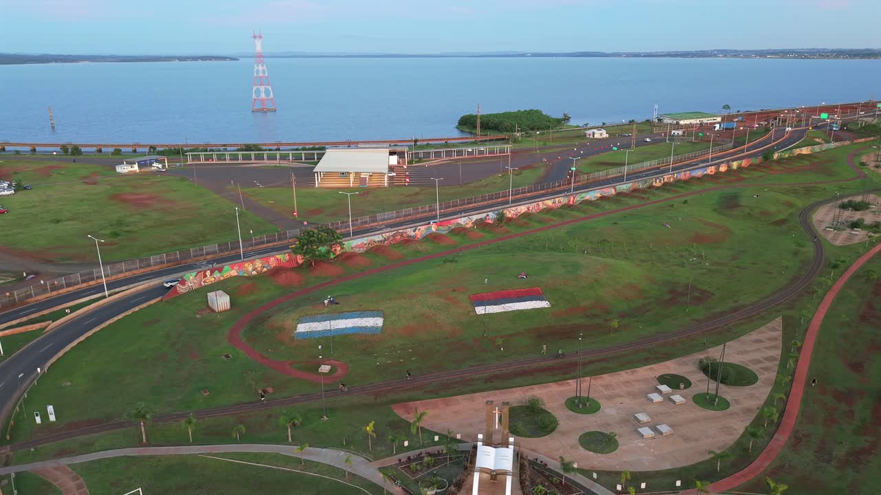 Aerial view of cultural resting park with cared grass and coast in background, Posadas, Misiones, Argentina.