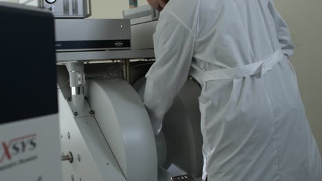 scientist operating advanced laboratory equipment